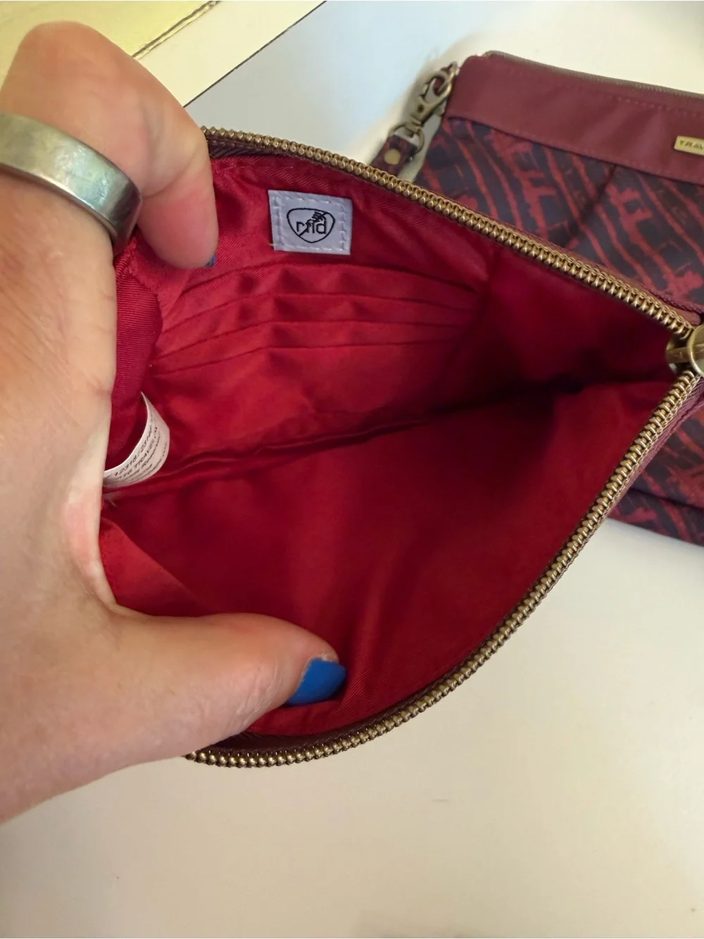Travelon Burgundy and Navy Patterned pouch w, palette, brushes, and lip balm